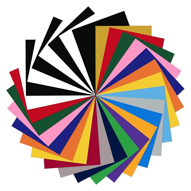 Hojas de vinilo de colores en círculo, entre ellas negro y blanco