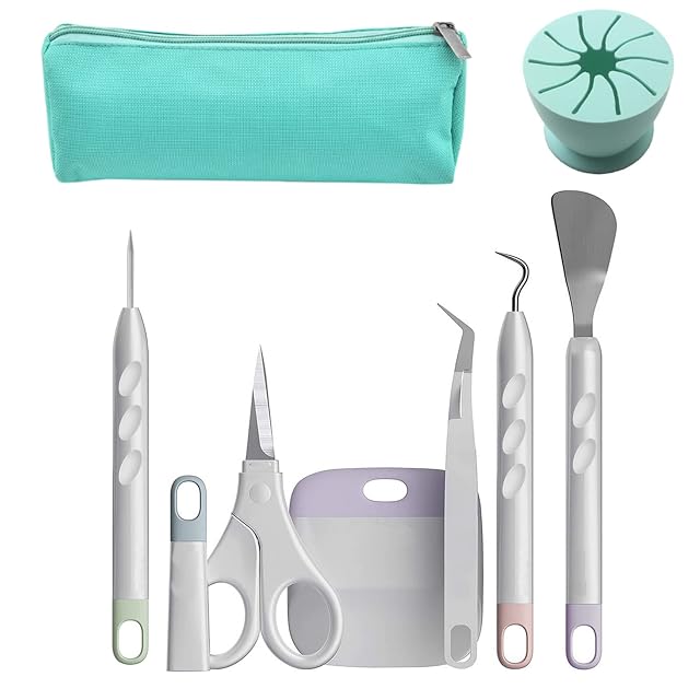 Bolsa con cremallera verde azulado, un recogedor de recortes redondo de silicona verde azulado, punzón, tijeras con capuchón, rasqueta, pinzas, gancho y espátula
